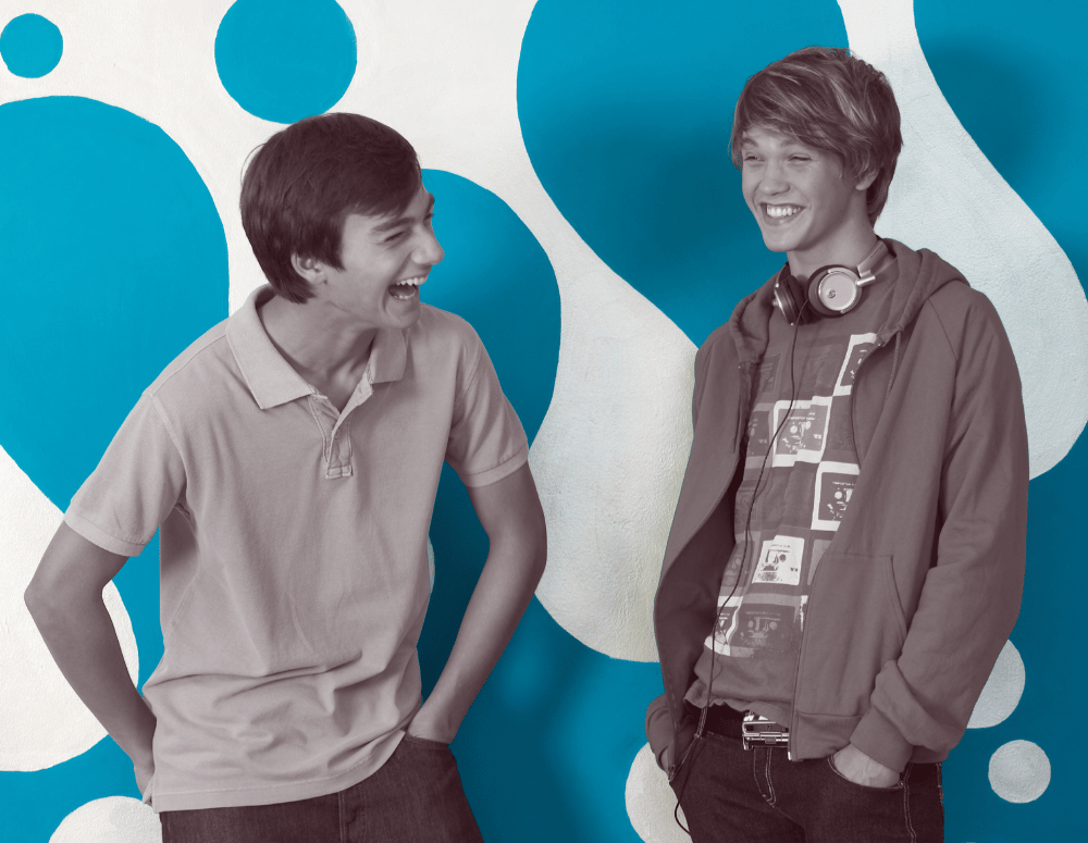 Two teen boys talking and laughing