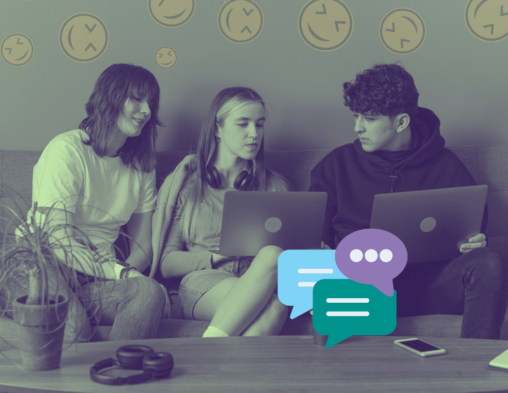 Three teens looking at laptops
