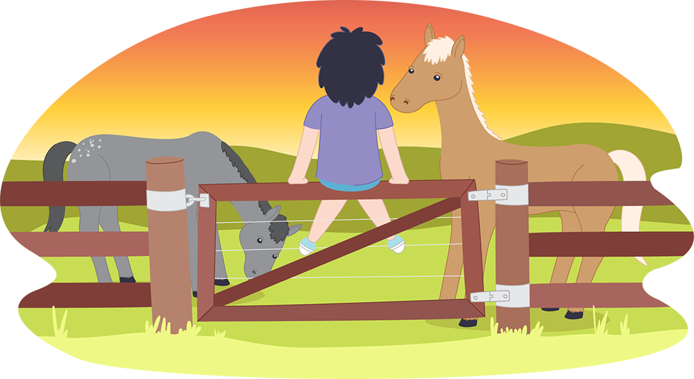 Child sitting on fence looking at horses at sunset