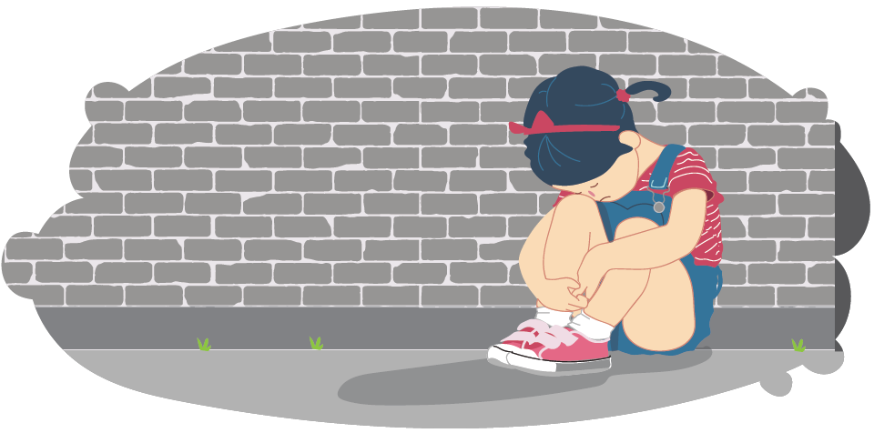 Upset girl sitting alone against brick wall