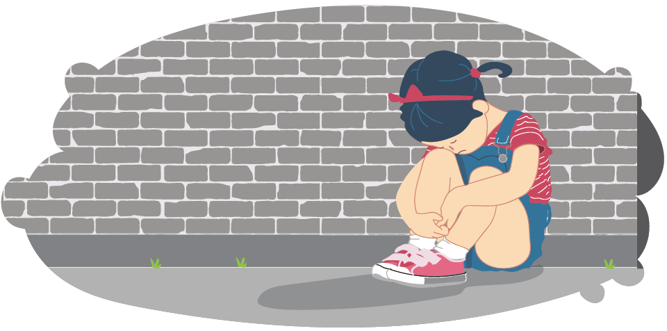 Upset girl sitting alone against brick wall