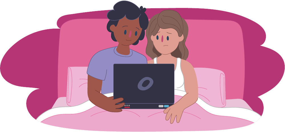 Woman and man sitting in bed watching porn on laptop