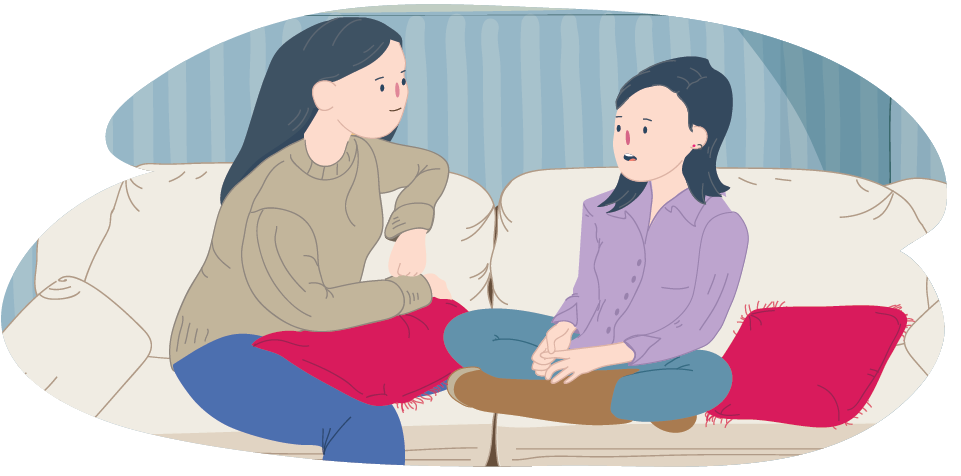 Mother and daughter sitting on couch talking